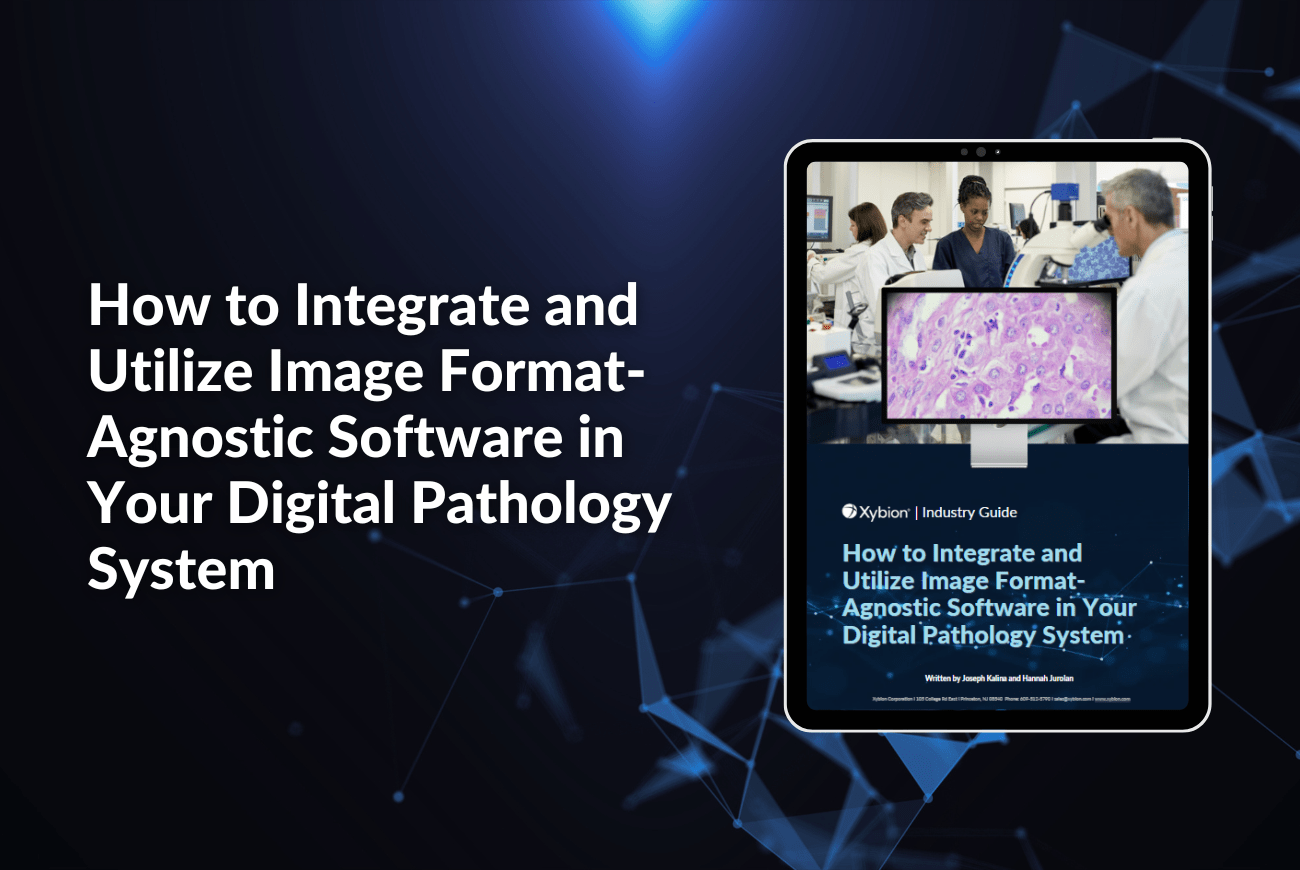 A promotional banner for the Xybion Industry Guide titled "How to Integrate and Utilize Image Format-Agnostic Software in Your Digital Pathology System." The banner features an image of the guide displayed on a tablet screen on the right, showing a digital pathology system with a microscopic image of tissue displayed on a monitor.