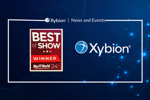 A promotional graphic for Xybion's News and Events, featuring the "Best of Show Winner" Bio-IT World 2024 award logo and the Xybion logo against a blue background with a digital, starry design.
